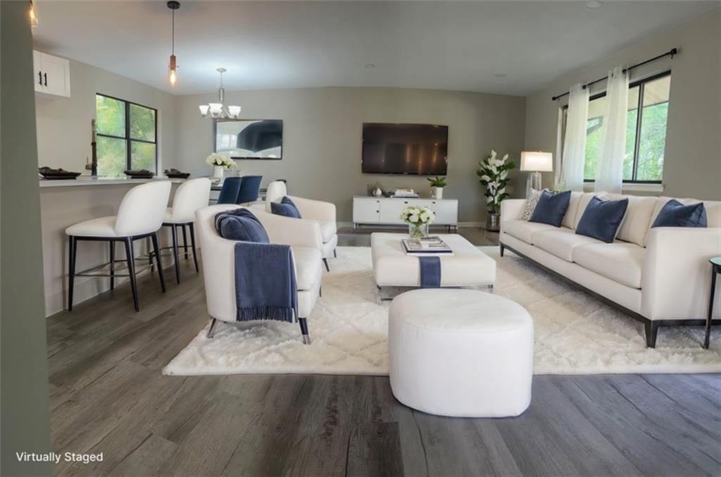 4293 Pleasant Ridge Road Decatur, GA 30034 - Photo 1 of 1 a living room with fireplace furniture and a flat screen tv