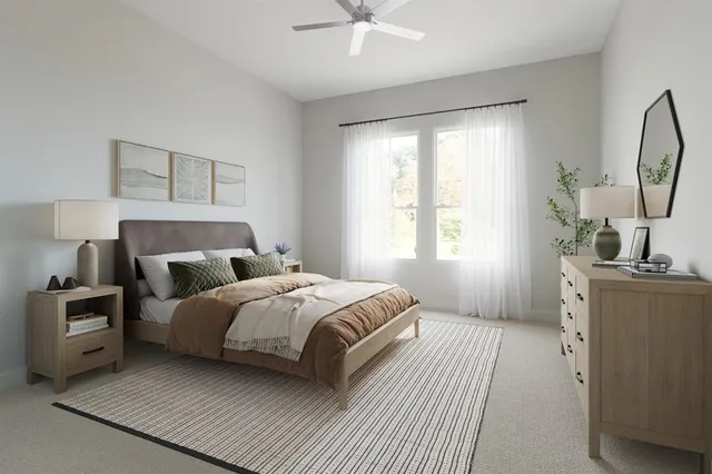 a bedroom with a bed wooden floor and window