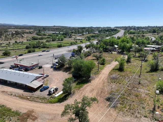 an aerial view of a house with a yard