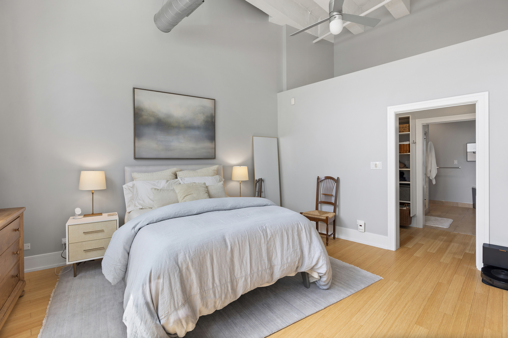 1800 Ridge Avenue, Unit 102 Evanston, IL 60201 - Photo 20 of 26 a bedroom with a bed and wooden floor