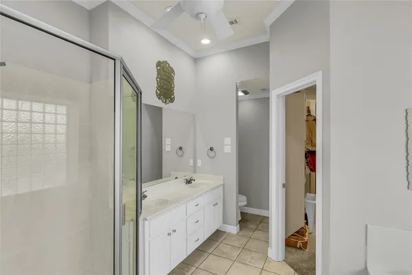 a bathroom with a mirror sink and vanity