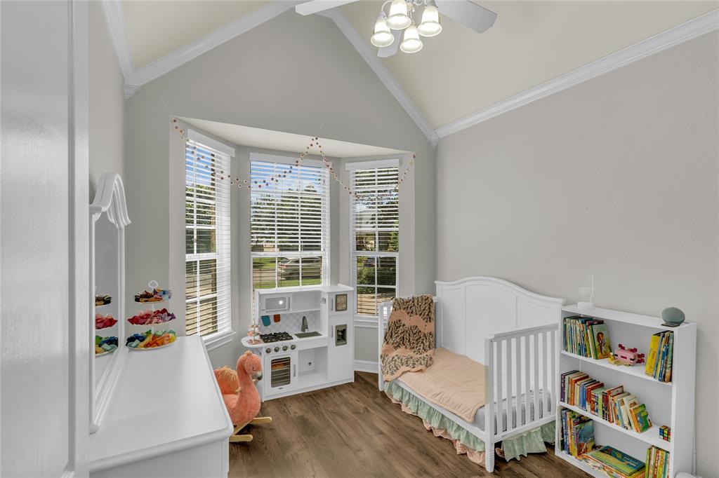 5613 Landsdown Drive Waco, TX 76708 - Photo 19 of 27 a bedroom with furniture and a large window
