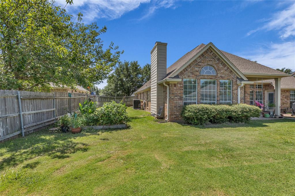 5613 Landsdown Drive Waco, TX 76708 - Photo 26 of 27 a front view of a house with garden