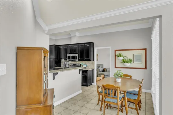 a dining room with furniture and window