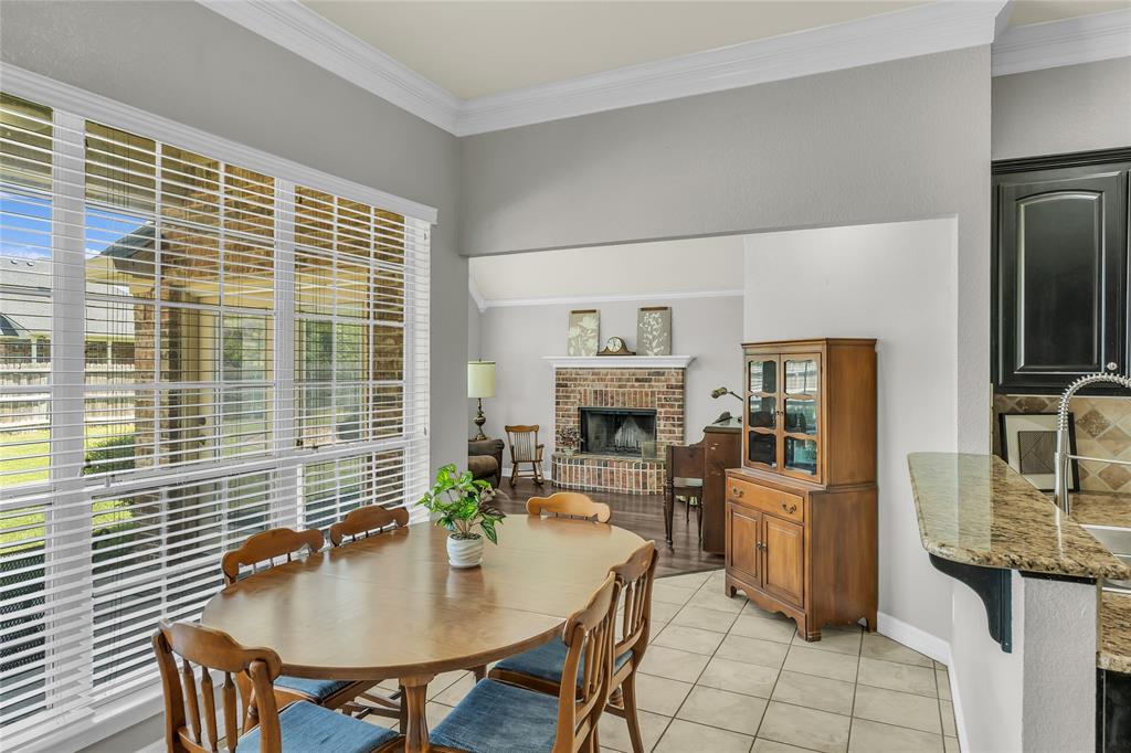 5613 Landsdown Drive Waco, TX 76708 - Photo 7 of 27 a workspace with furniture and fireplace