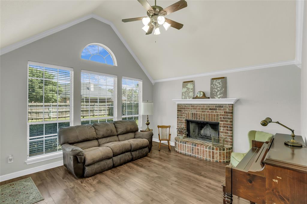 5613 Landsdown Drive Waco, TX 76708 - Photo 8 of 27 a living room with furniture and a fireplace