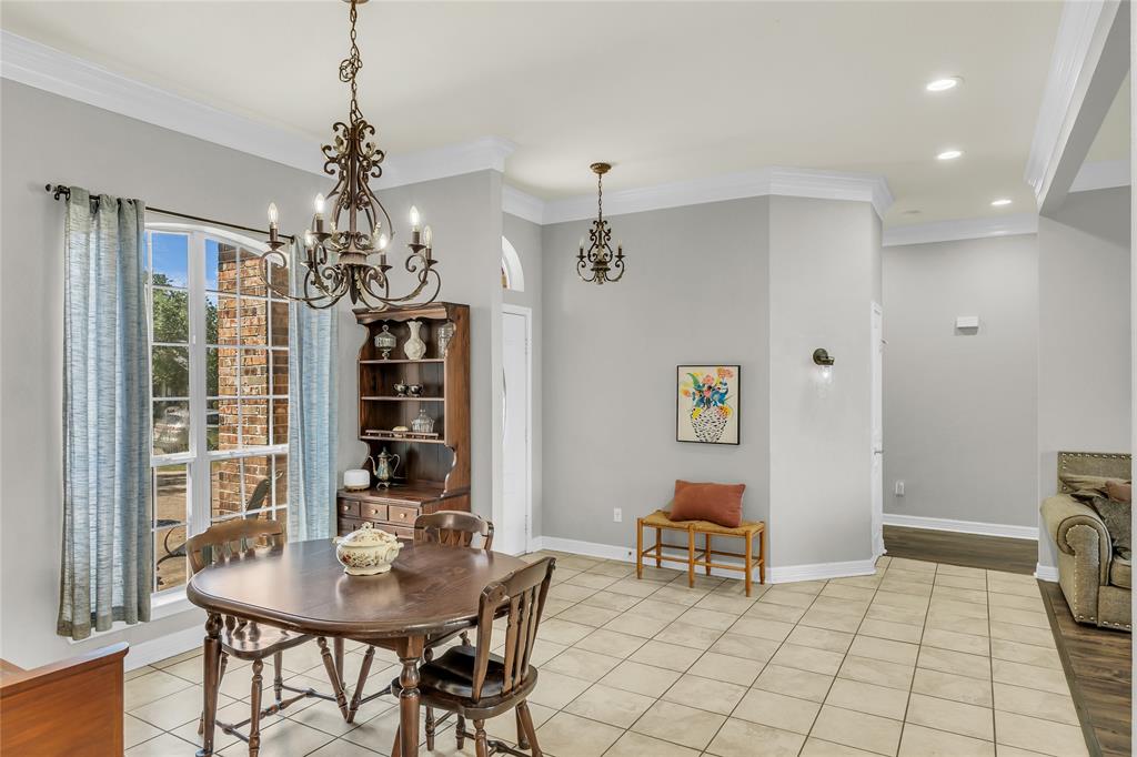 5613 Landsdown Drive Waco, TX 76708 - Photo 9 of 27 a view of a dining room with furniture and chandelier