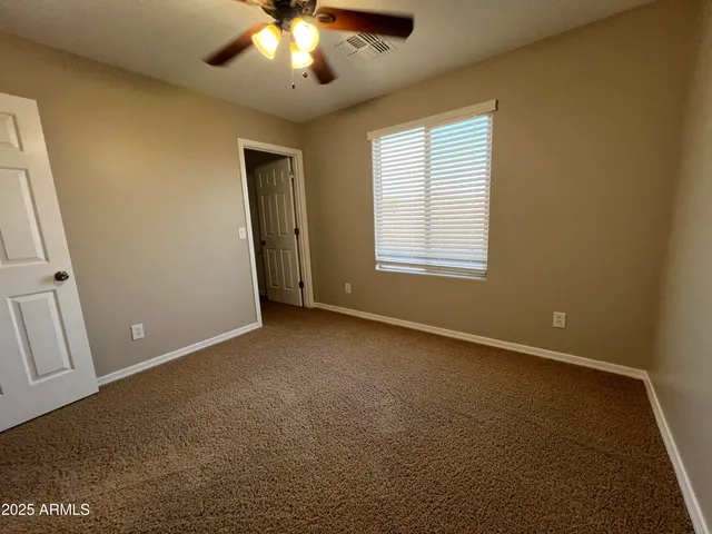 a bathroom with a double vanity sink and mirror