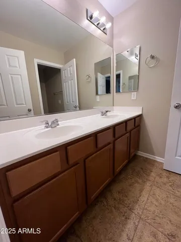 a white toilet sitting next to a bath tub