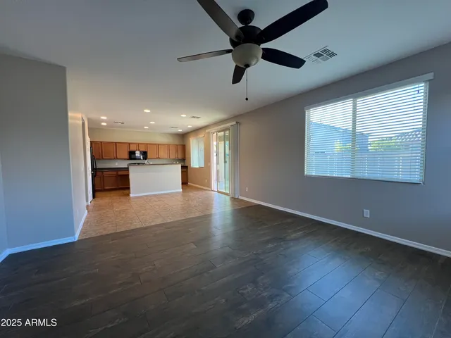 a view of a kitchen with a dishwasher cabinets and a large window