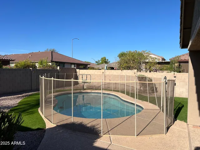 a view of a swimming pool with a patio