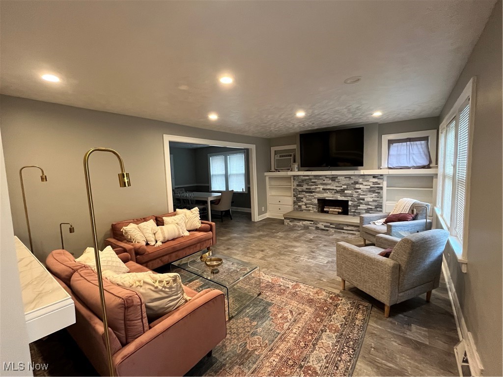 1048 Pembrook Road Cleveland, OH 44121 - Photo 4 of 26 Living room featuring a fireplace and hardwood / wood-style floors