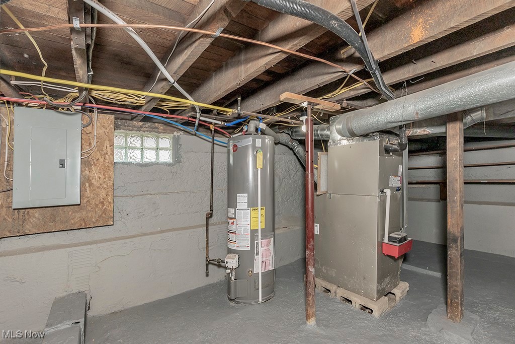 12447 Chillicothe Road Chesterland, OH 44026 - Photo 42 of 42 Utility room featuring gas water heater, electric panel, and heating unit