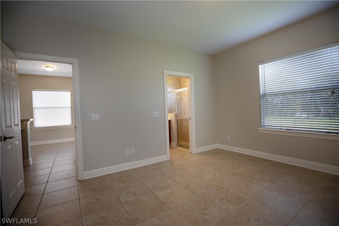 12722 River Road Fort Myers, FL 33905 - Photo 12 of 18 an empty room with a bathroom and a window