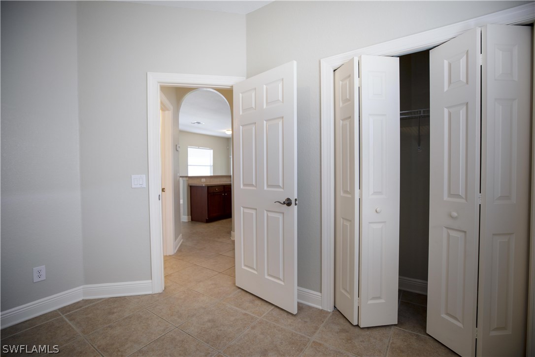 12722 River Road Fort Myers, FL 33905 - Photo 15 of 18 an empty room with closet and a bathroom