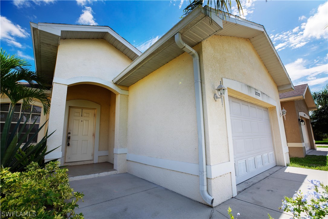 12722 River Road Fort Myers, FL 33905 - Photo 2 of 18 a view of a wooden door of the house