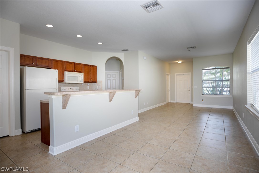 12722 River Road Fort Myers, FL 33905 - Photo 6 of 18 a view of a kitchen with a sink and a window
