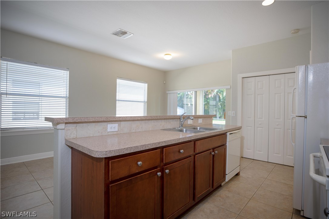 12722 River Road Fort Myers, FL 33905 - Photo 8 of 18 a bathroom with a granite countertop sink and a window