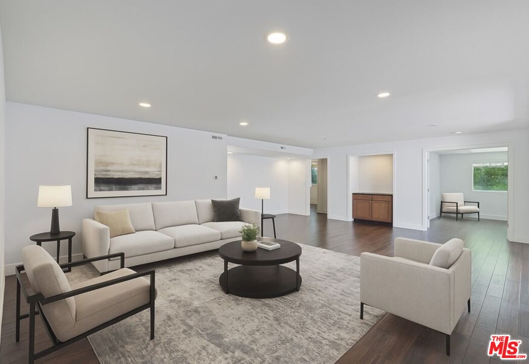 603 North Doheny Drive, Unit 2B Beverly Hills, CA 90210 - Photo 1 of 21 a living room with furniture and a wooden floor