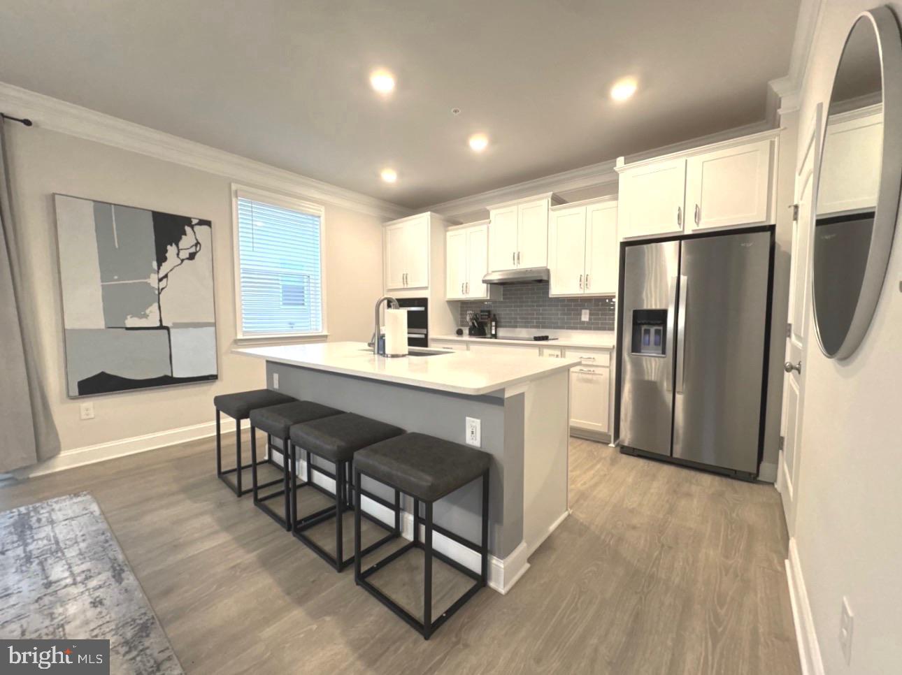 28 Buttercup Circle Elkton, MD 21921 - Photo 6 of 27 a kitchen with a refrigerator a sink and a dining table