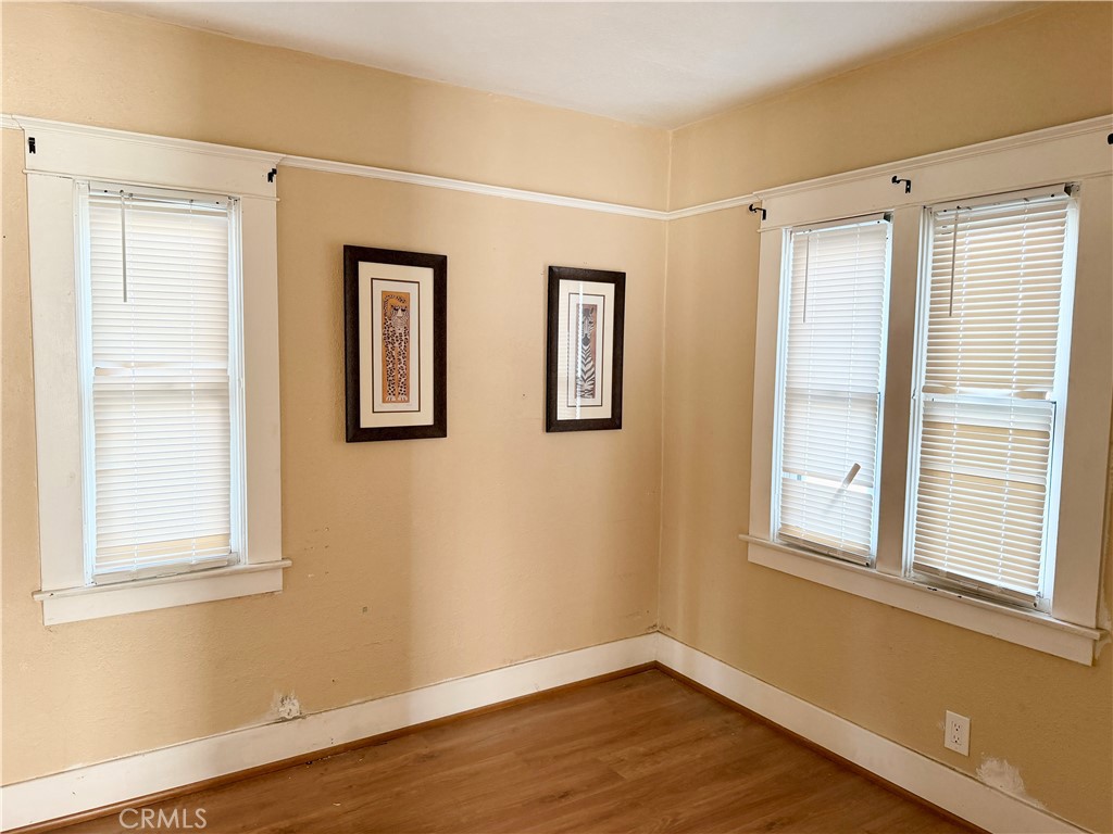 4451 Victoria Riverside, CA 92507 - Photo 11 of 17 a view of an empty room with wooden floor and a window