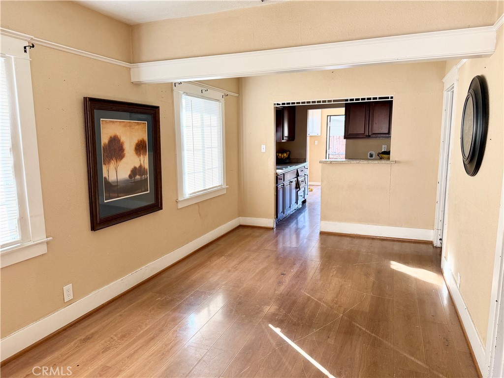 4451 Victoria Riverside, CA 92507 - Photo 4 of 17 a view of a hallway with wooden floor and a living room