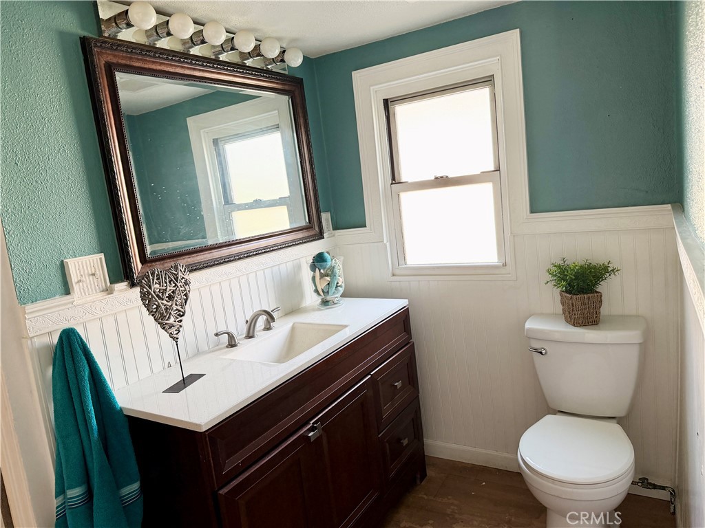 4451 Victoria Riverside, CA 92507 - Photo 9 of 17 a bathroom with a toilet sink and mirror