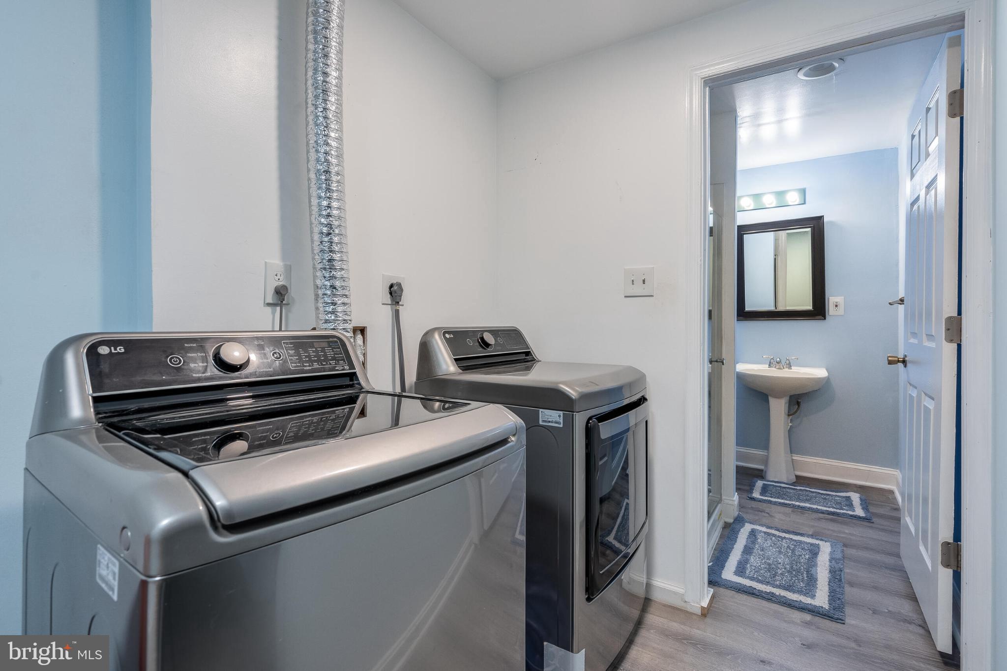 14087 Asher View Centreville, VA 20121 - Photo 18 of 26 Modern laundry space with sleek appliances.