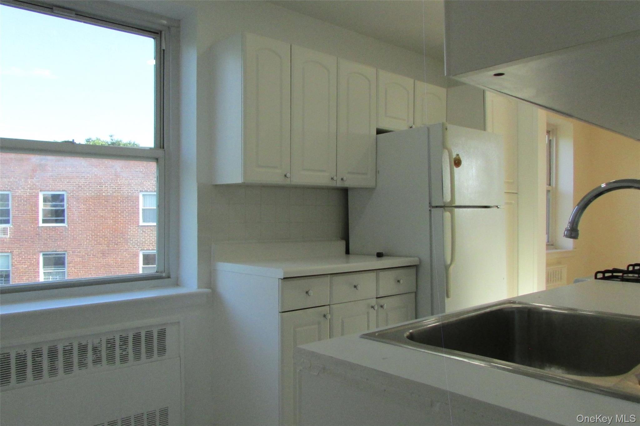 30 South Cole Avenue, Unit 6F Spring Valley, NY 10977 - Photo 11 of 30 a bathroom with a bathtub and a window