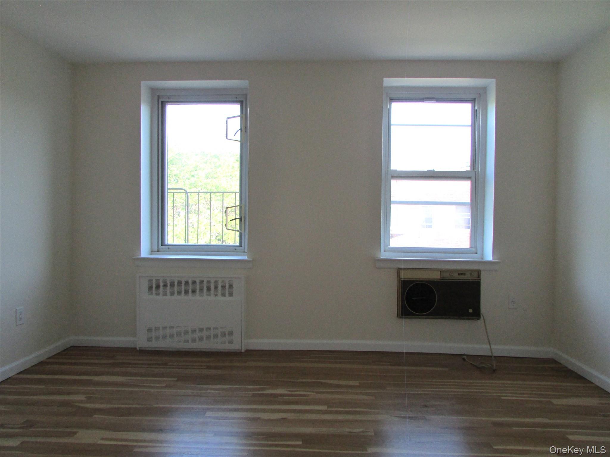 30 South Cole Avenue, Unit 6F Spring Valley, NY 10977 - Photo 18 of 30 an empty room with wooden floor and windows
