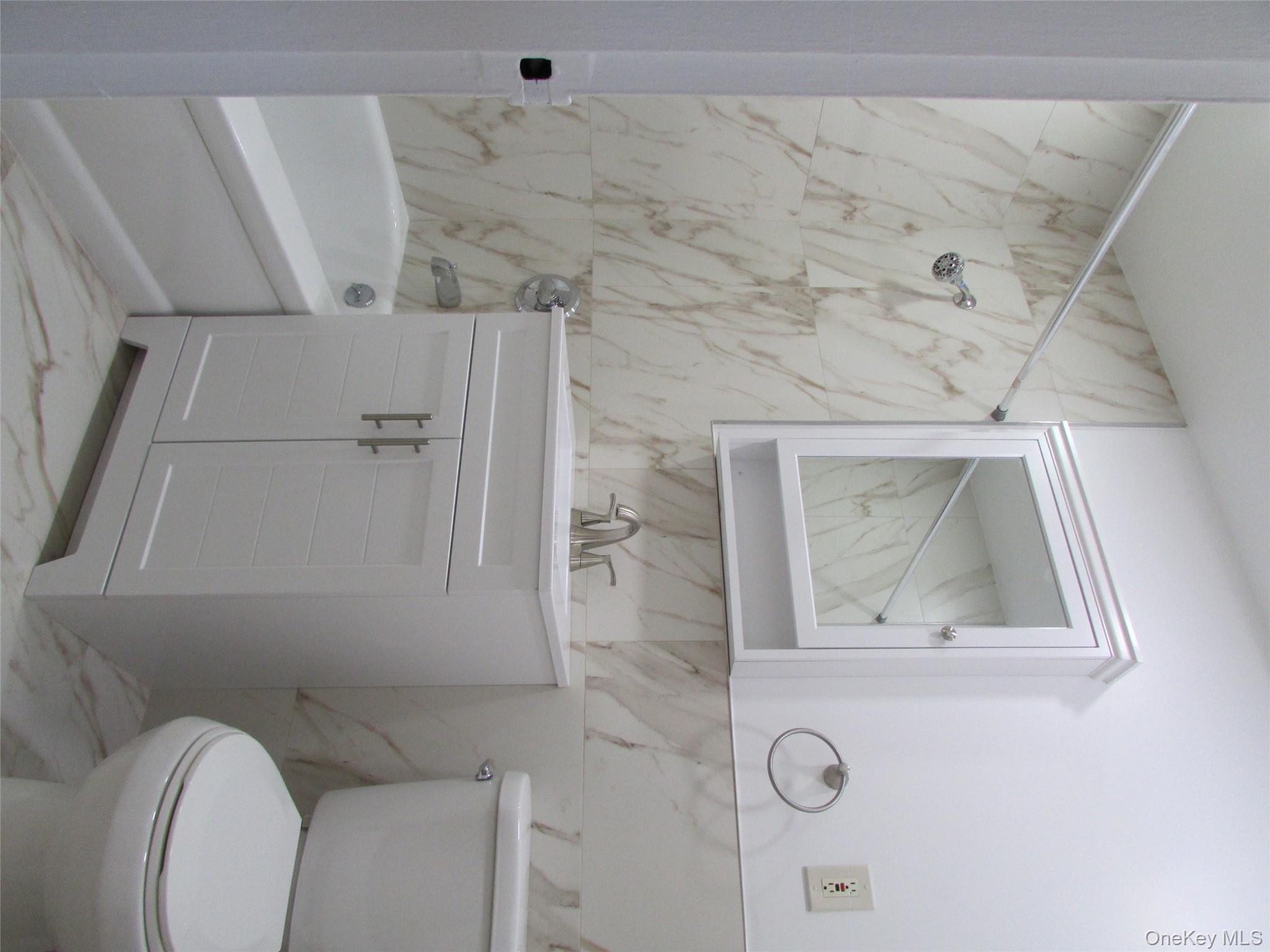 30 South Cole Avenue, Unit 6F Spring Valley, NY 10977 - Photo 20 of 30 a bathroom with a sink toilet and vanity