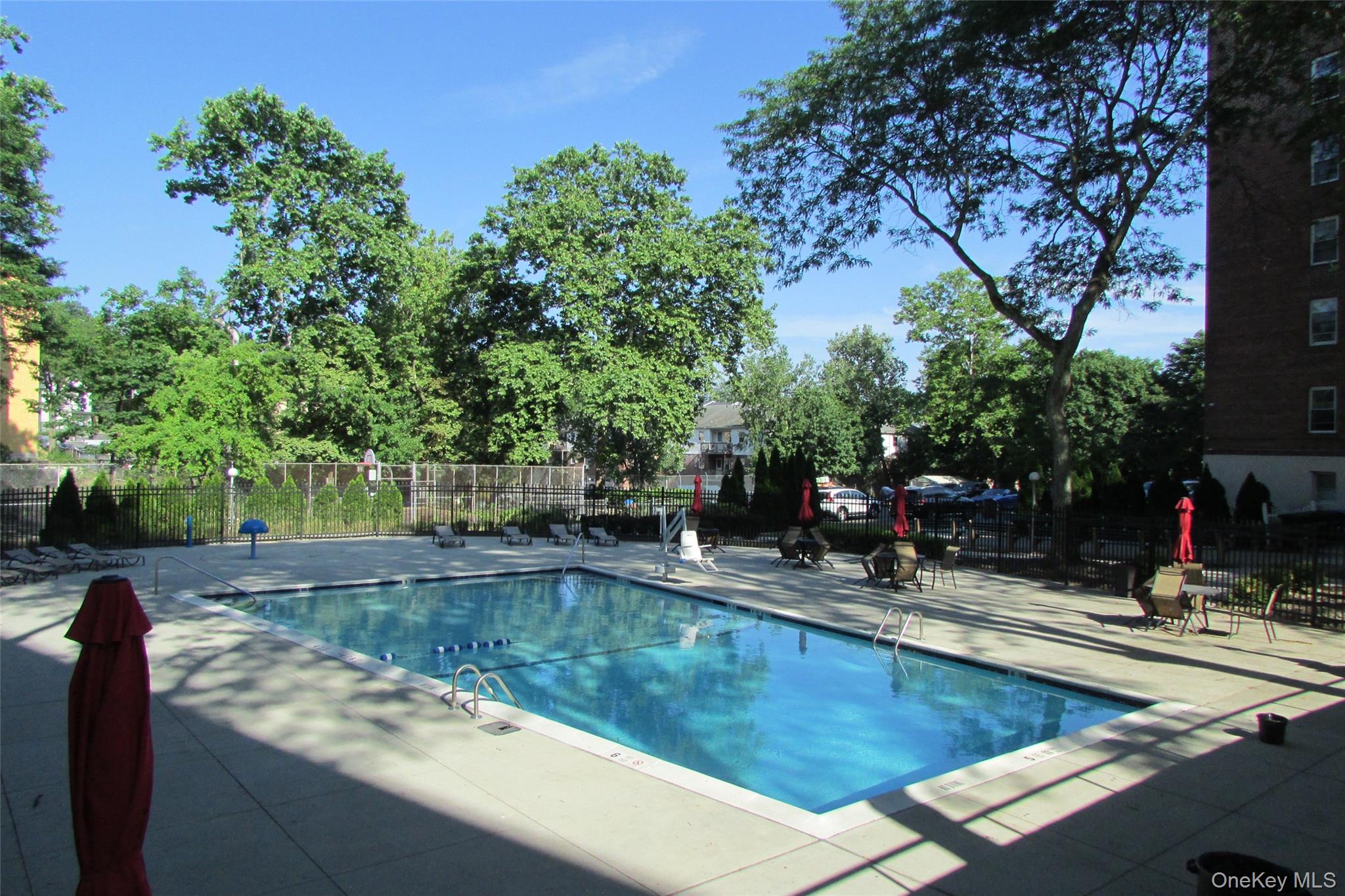30 South Cole Avenue, Unit 6F Spring Valley, NY 10977 - Photo 26 of 30 a view of a swimming pool with chairs