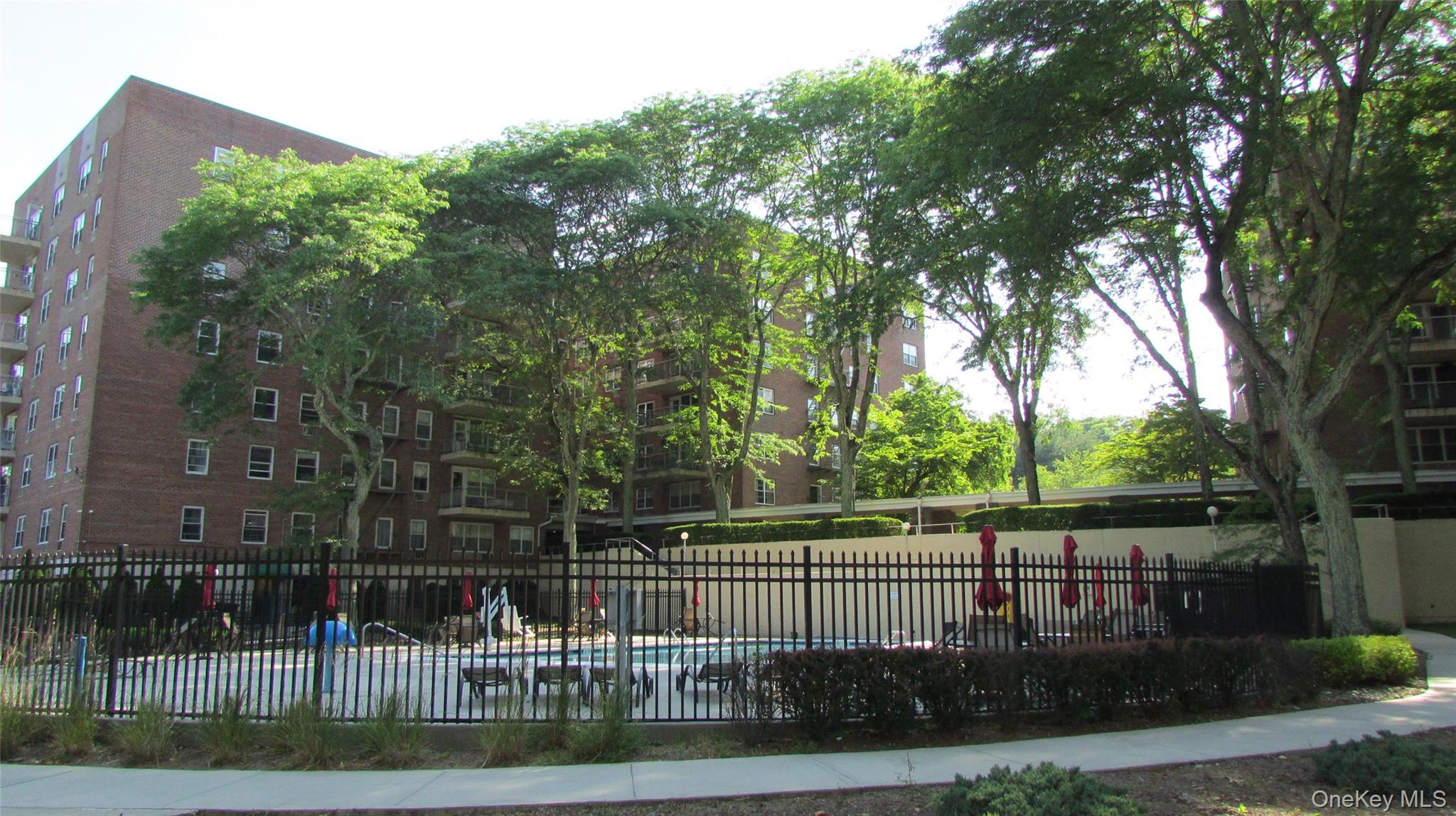 30 South Cole Avenue, Unit 6F Spring Valley, NY 10977 - Photo 30 of 30 a front view of a house with a garden