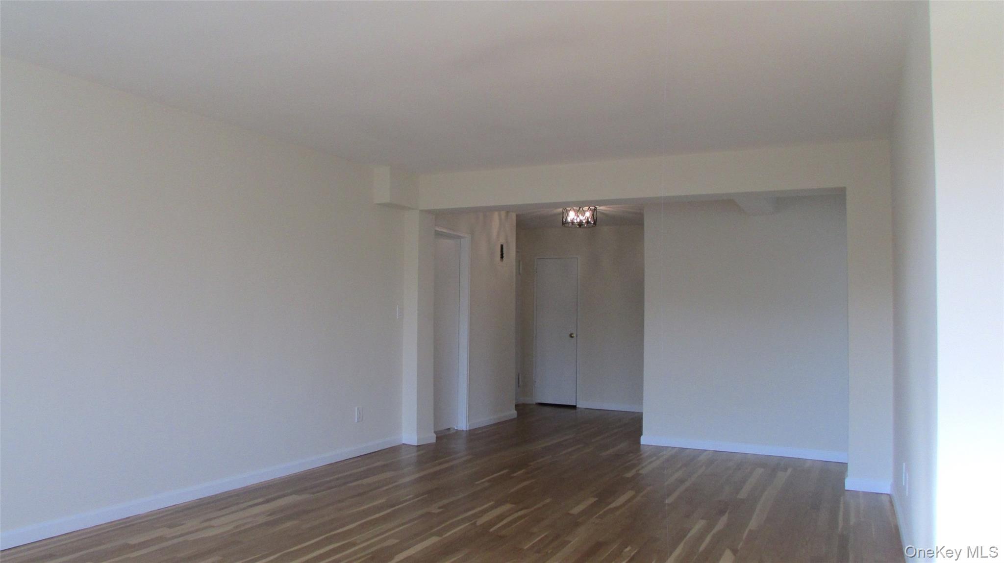 30 South Cole Avenue, Unit 6F Spring Valley, NY 10977 - Photo 5 of 30 a view of an empty room with wooden floor
