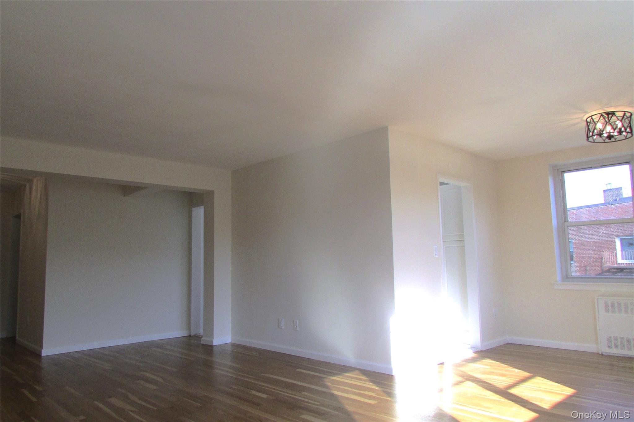30 South Cole Avenue, Unit 6F Spring Valley, NY 10977 - Photo 7 of 30 a view of empty room with wooden floor