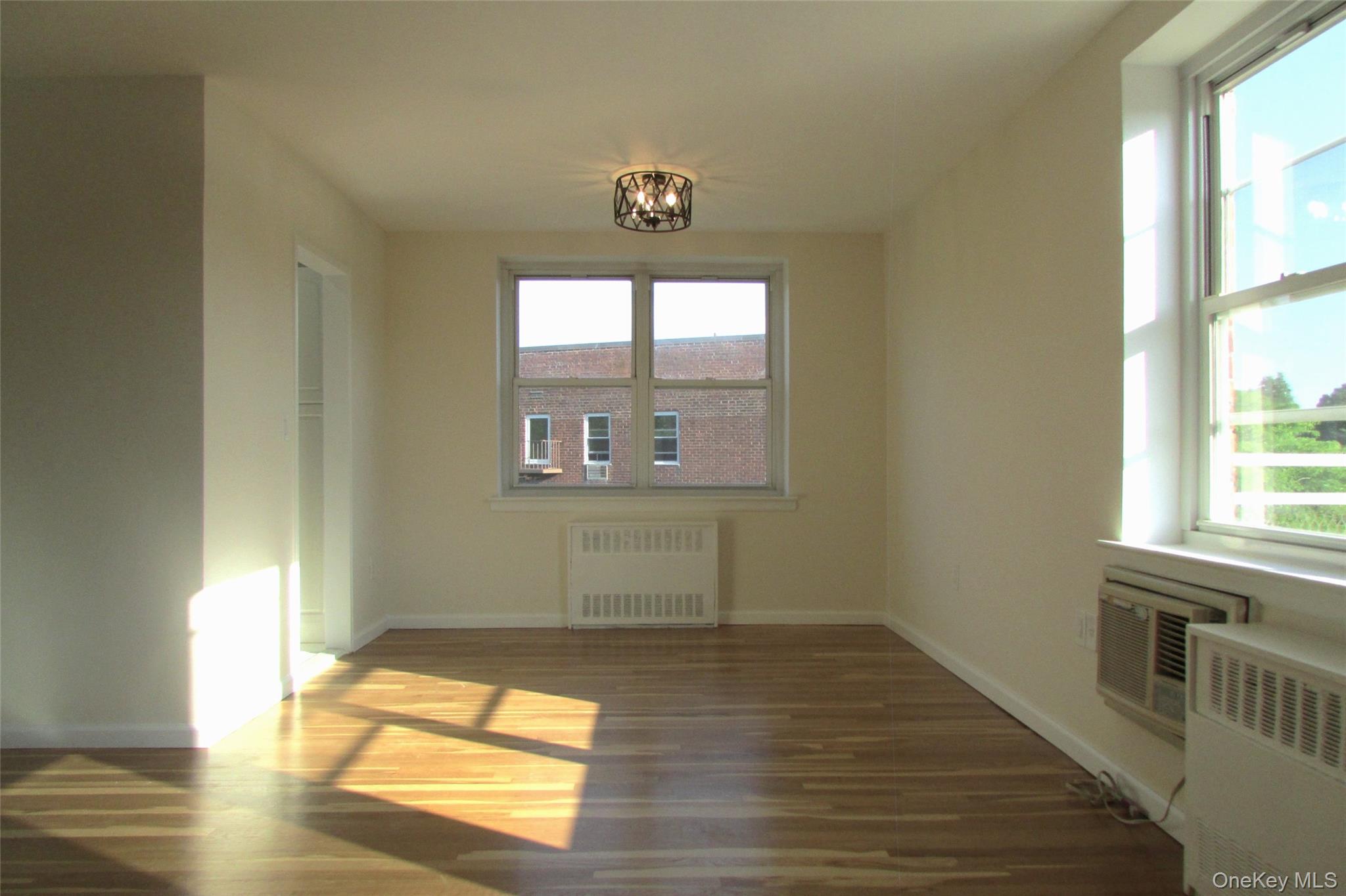 30 South Cole Avenue, Unit 6F Spring Valley, NY 10977 - Photo 8 of 30 a view of empty room with wooden floor and fan
