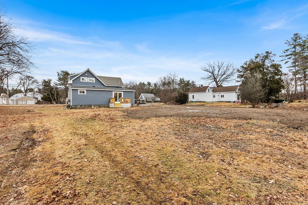 233 Central Street Foxboro, MA 02035 - Photo 14 of 16 a view of a house with a yard