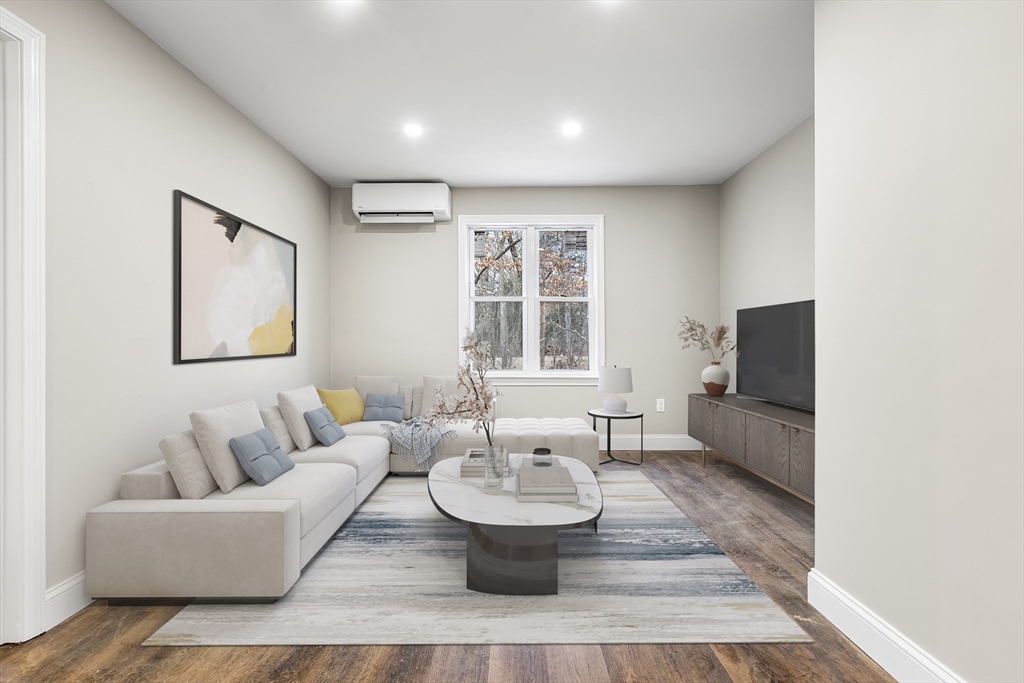 233 Central Street Foxboro, MA 02035 - Photo 4 of 16 a living room with couches and a flat screen tv