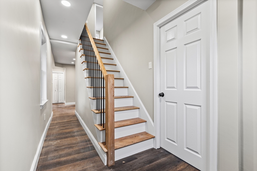 233 Central Street Foxboro, MA 02035 - Photo 5 of 16 a view of a hallway with wooden floor and entryway