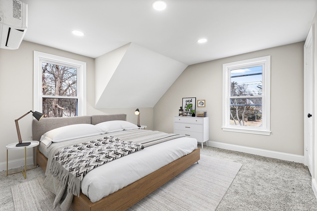 233 Central Street Foxboro, MA 02035 - Photo 7 of 16 a bedroom with a large bed and a window