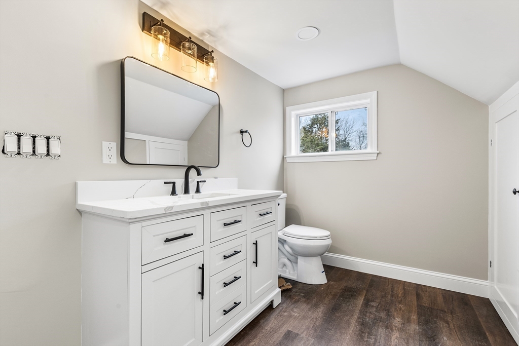 233 Central Street Foxboro, MA 02035 - Photo 10 of 16 a bathroom with a toilet sink and mirror