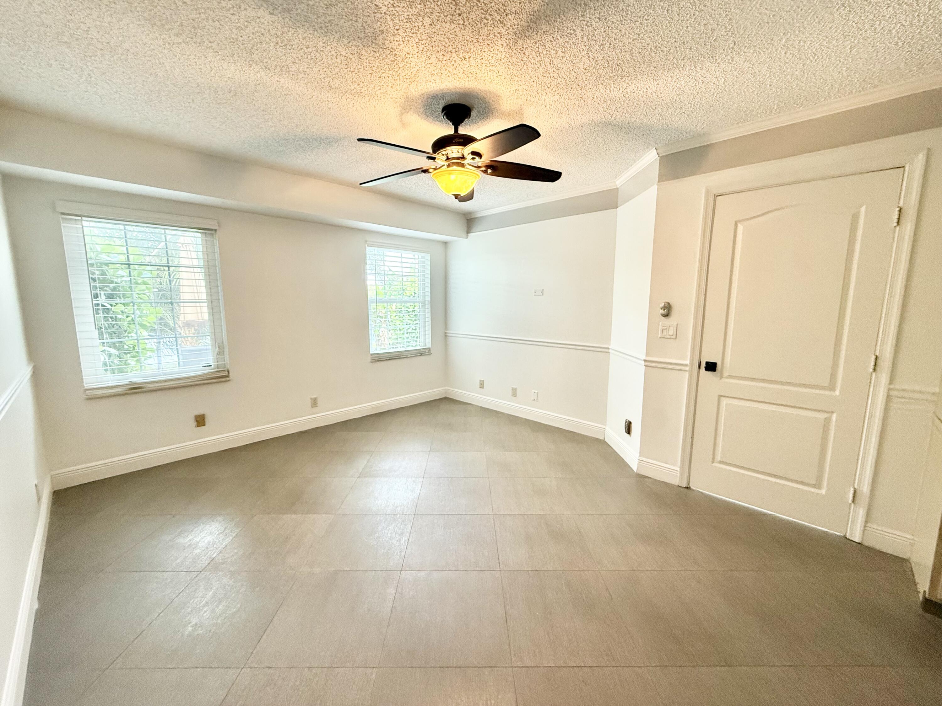 9190 Boca Gardens Parkway, Unit B Boca Raton, FL 33496 - Photo 7 of 35 a view of empty room with ceiling fan
