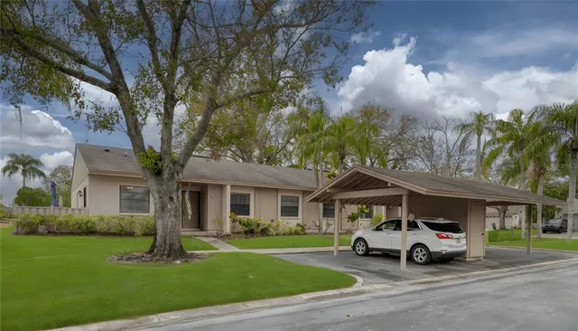 a car parked in front of white house