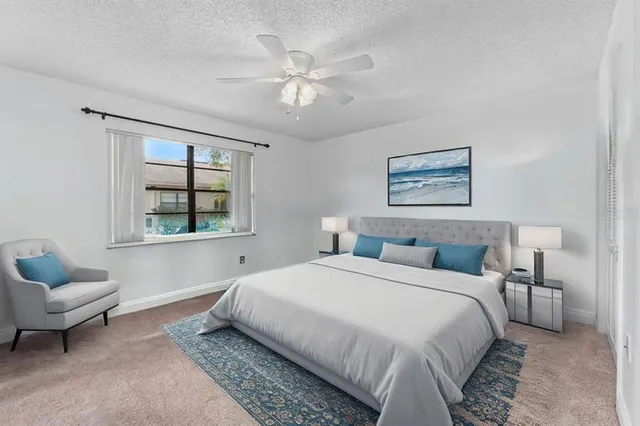 a bedroom with a bed and a couch