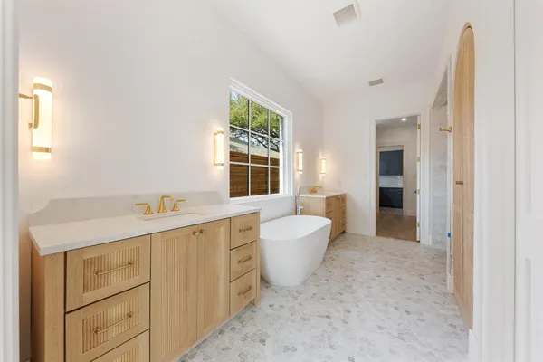 a view of a kitchen with sink and window