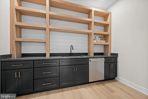 a kitchen with a sink and cabinets