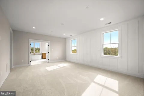 a view of a livingroom with a dishwasher and a large window