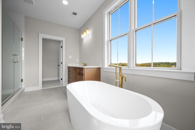 a view of a kitchen with furniture and a window