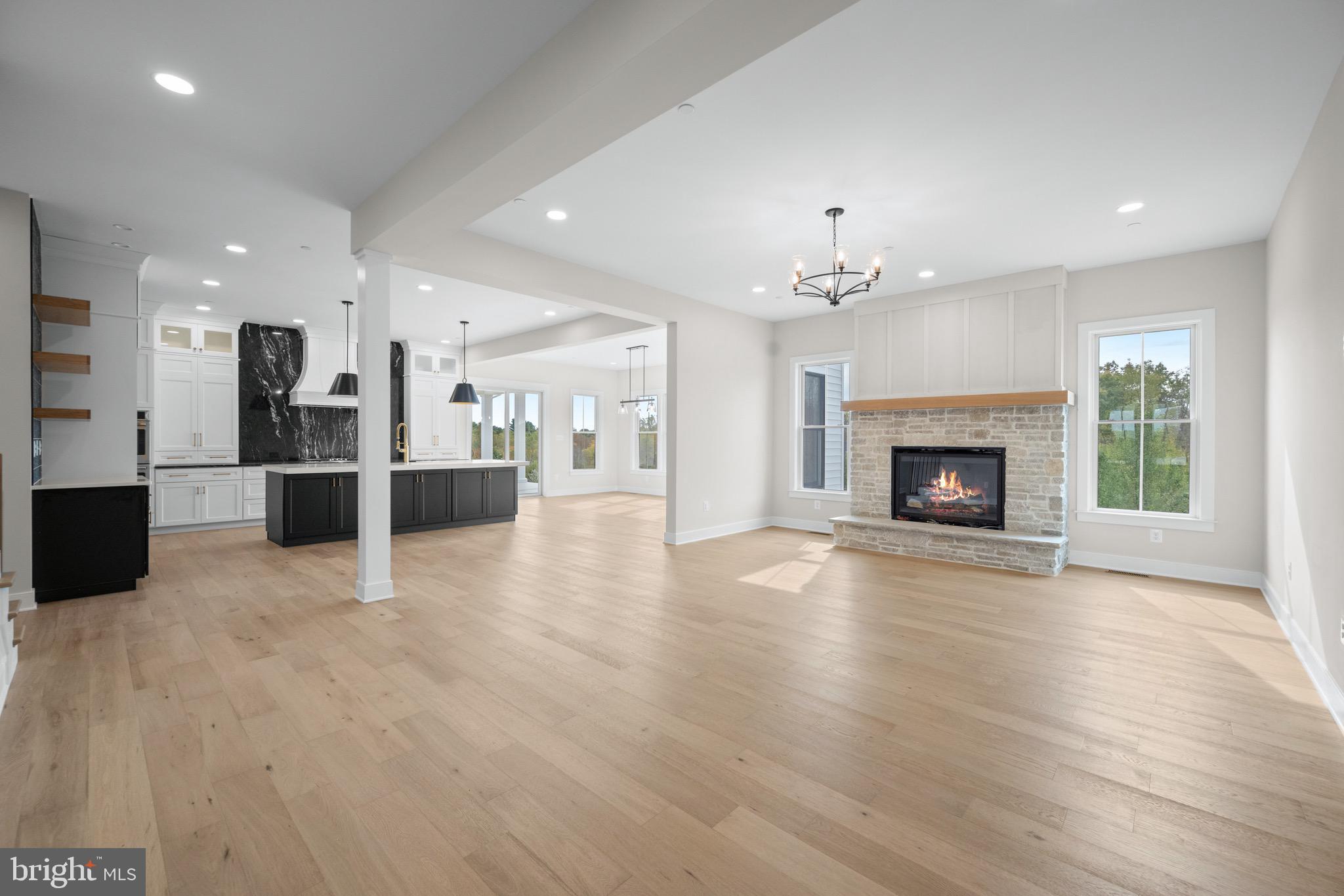 869 Morgan Station Road Woodbine, MD 21797 - Photo 8 of 38 a view of a big room with wooden floor and a kitchen