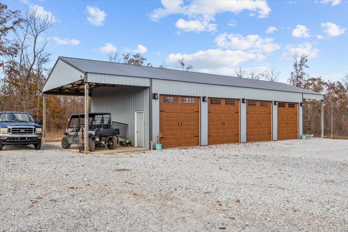 120 Fiser Road Waverly, TN 37185 - Photo 29 of 46 a view of a house with large trees and furniture